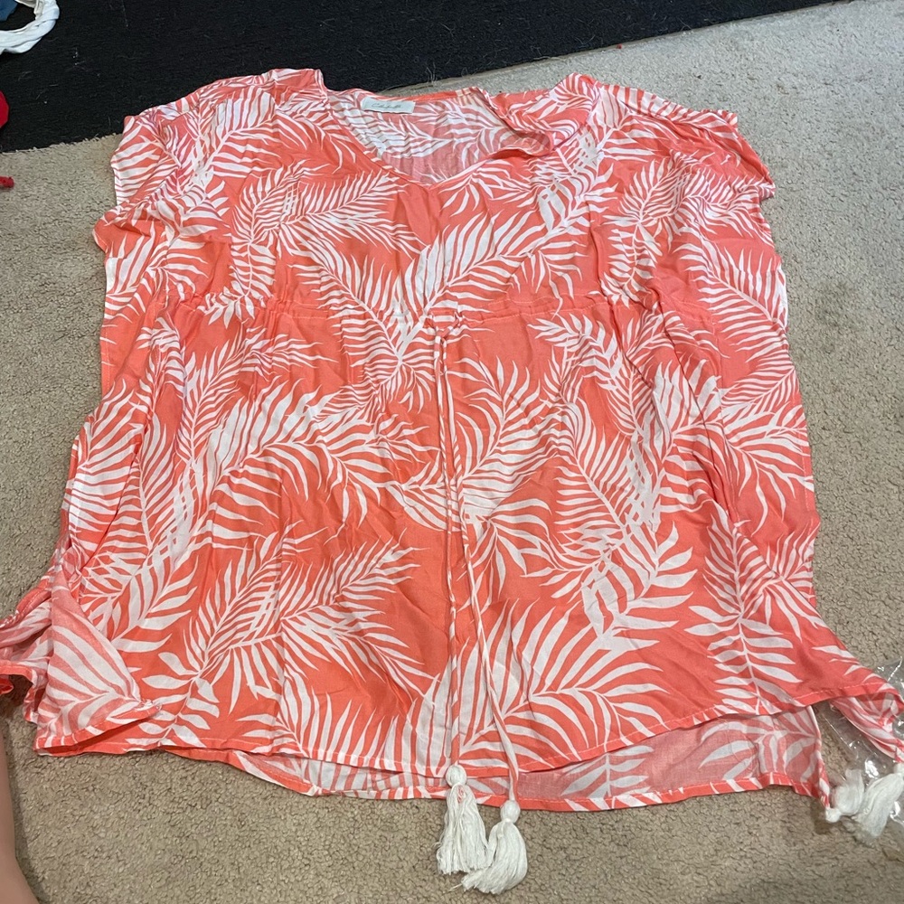 beach cover-up, it’s a pretty peachy pink and white color